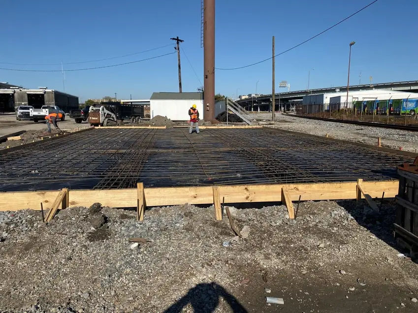 Steel reinforcement and timber forms for a concrete foundation
