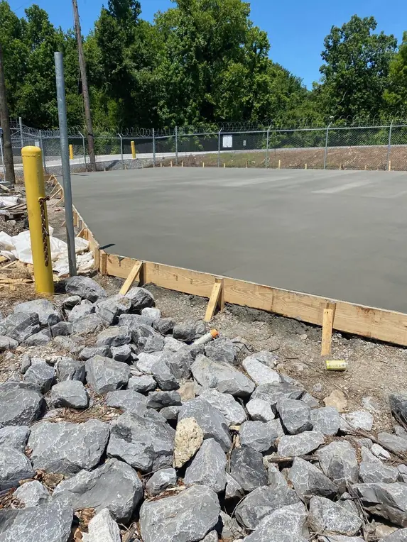 Completed concrete slab beside an embankment