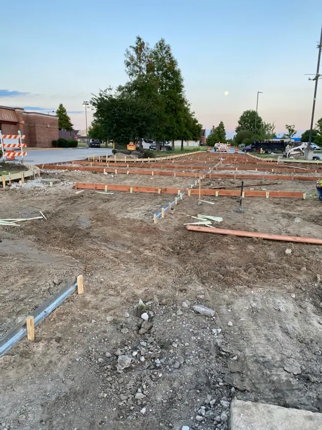 Construction site with forms and service pipework